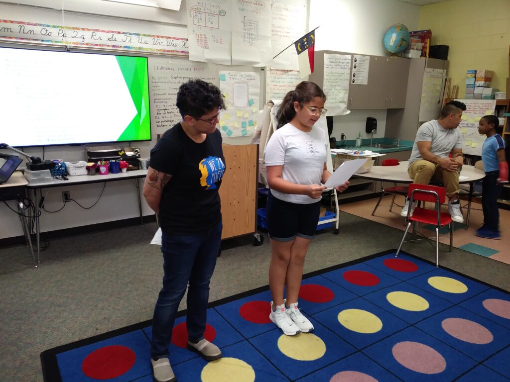 Michelle Rosquillo and a student at Hodge Road Elementary during our We 2 R Poets workshop